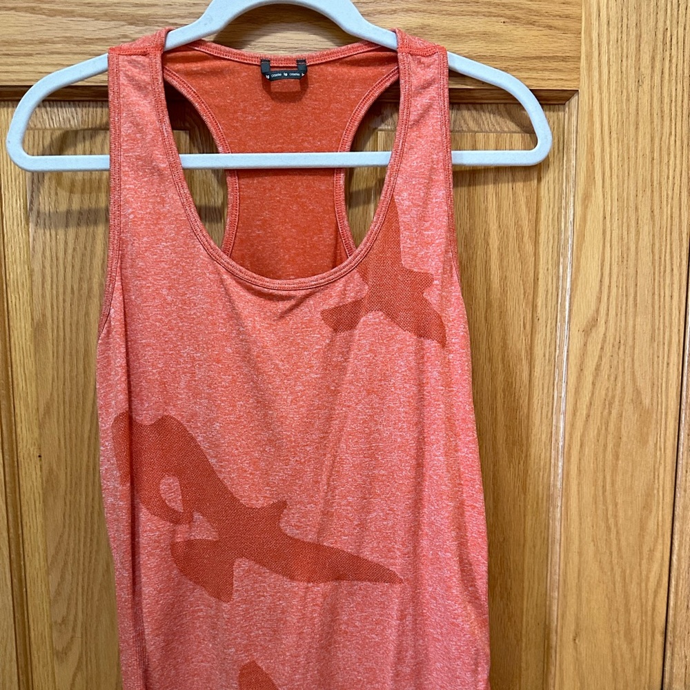 Oiselle women’s orange/tangerine racer back tank top, size large.